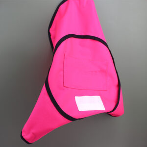 Custom round fire resistant fabric cover in hot pink, folded view showing fabric pocket and neat stitching